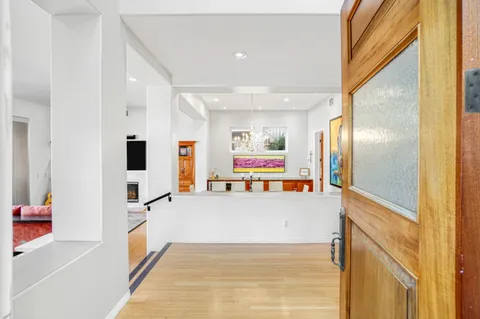 a view of a living room with a large window