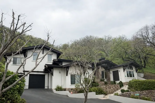 a view of a house with a street