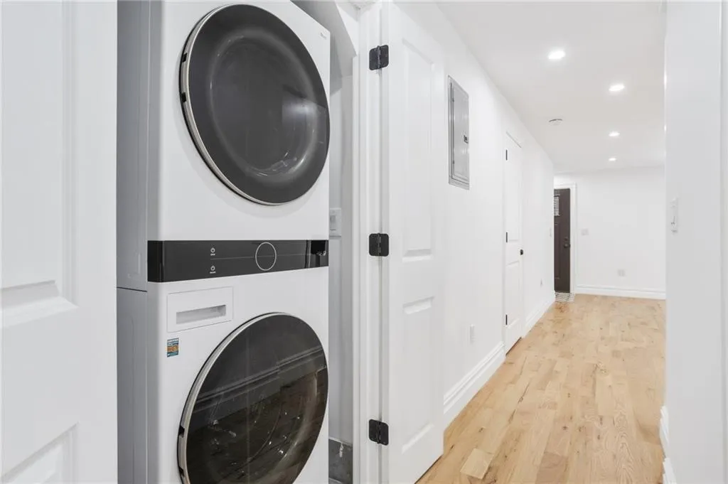 a view of a hallway with washer and dryer