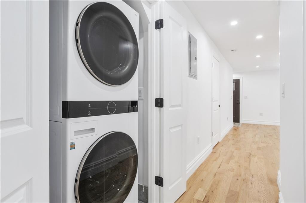 760 Decatur Street, Unit 1 Brooklyn, NY 11233 - Photo 5 of 12 a view of a hallway with washer and dryer