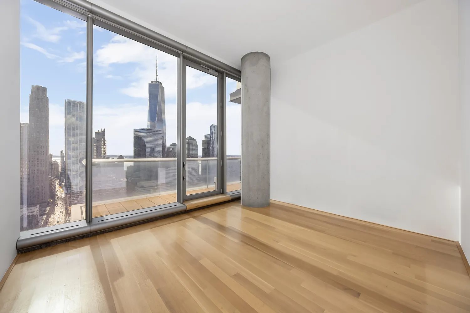 a view of a glass door and the balcony