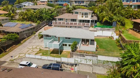 an aerial view of a house with swimming pool
