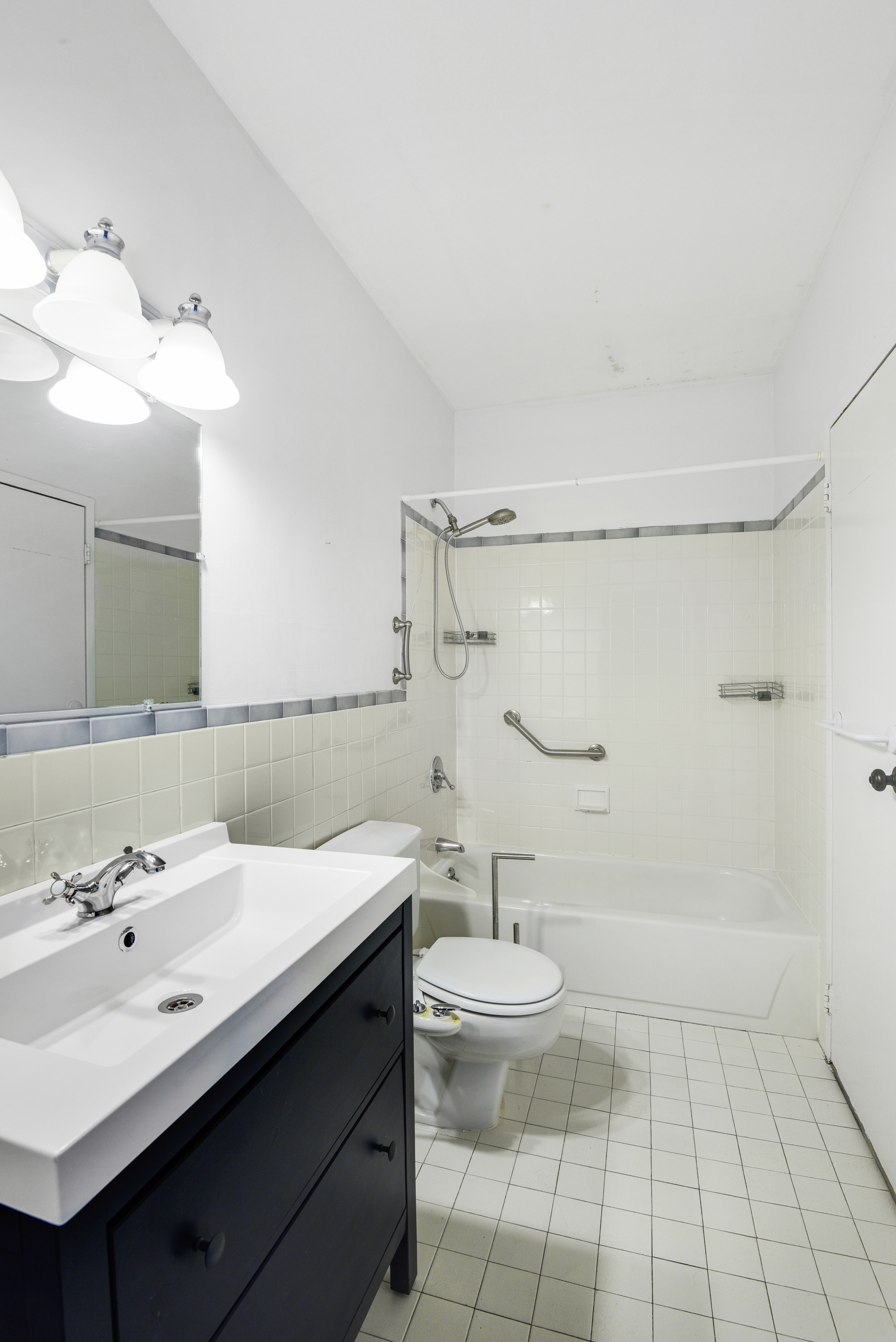 492 Henry Street, Unit 2A Brooklyn, NY 11231 - Photo 8 of 13 a bathroom with a sink a toilet and shower