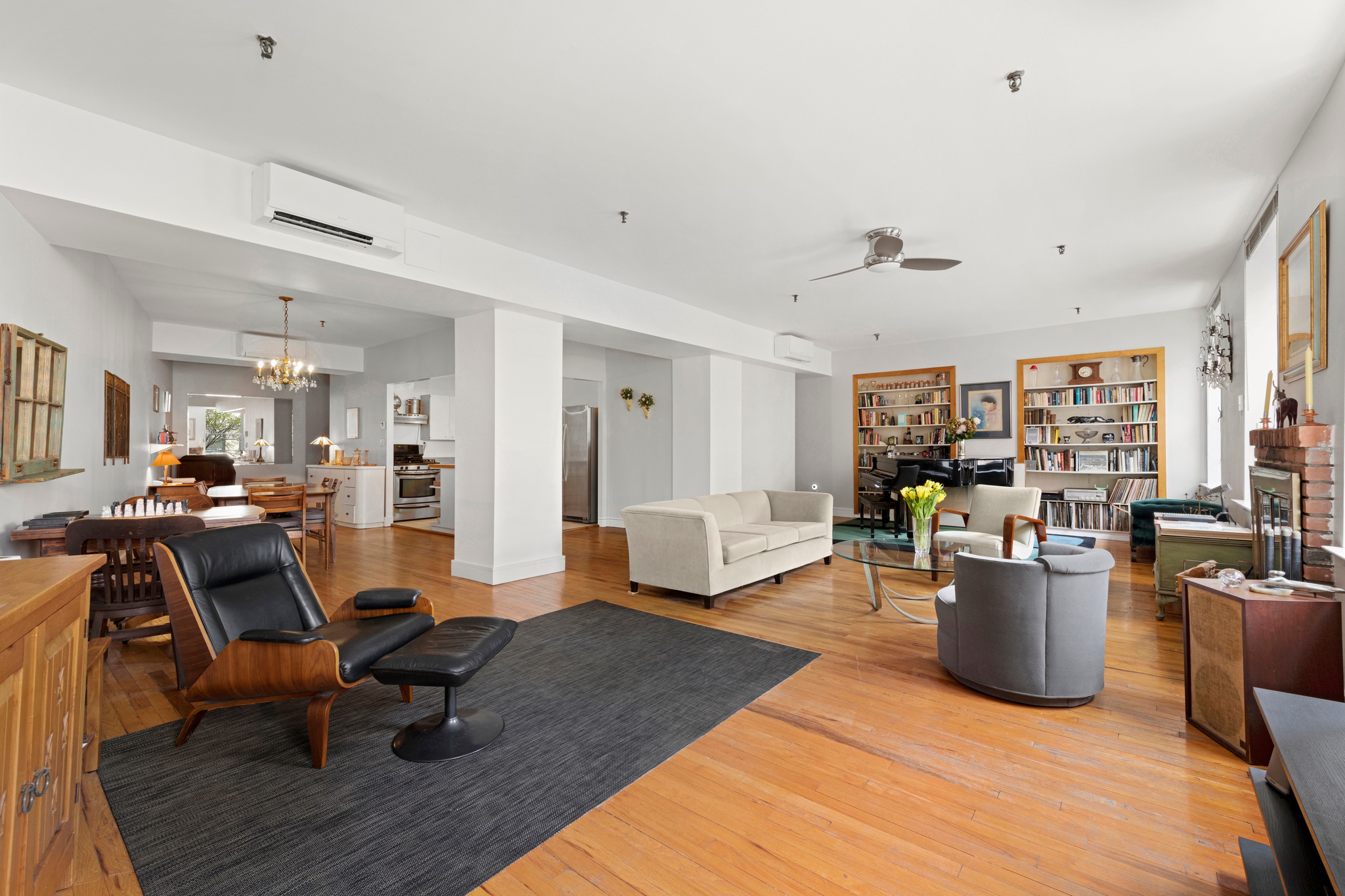 166 Bank Street, Unit LOFT2C Manhattan, NY 10014 - Photo 2 of 11 a living room with furniture and wooden floor