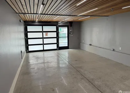 a view of an empty room with a windows