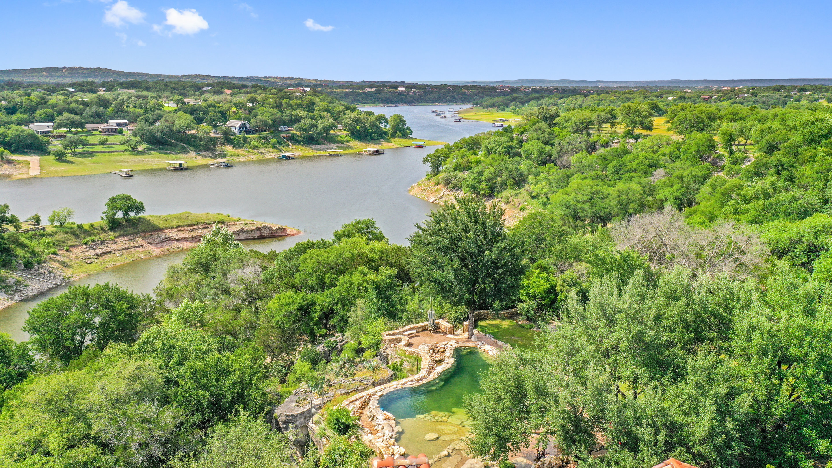 808 Rivercliff Drive Spicewood, TX 78669 - Photo 61 of 71 a view of a lake with a city view