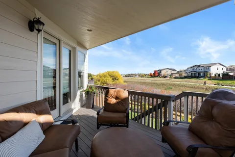 a balcony with furniture and city view