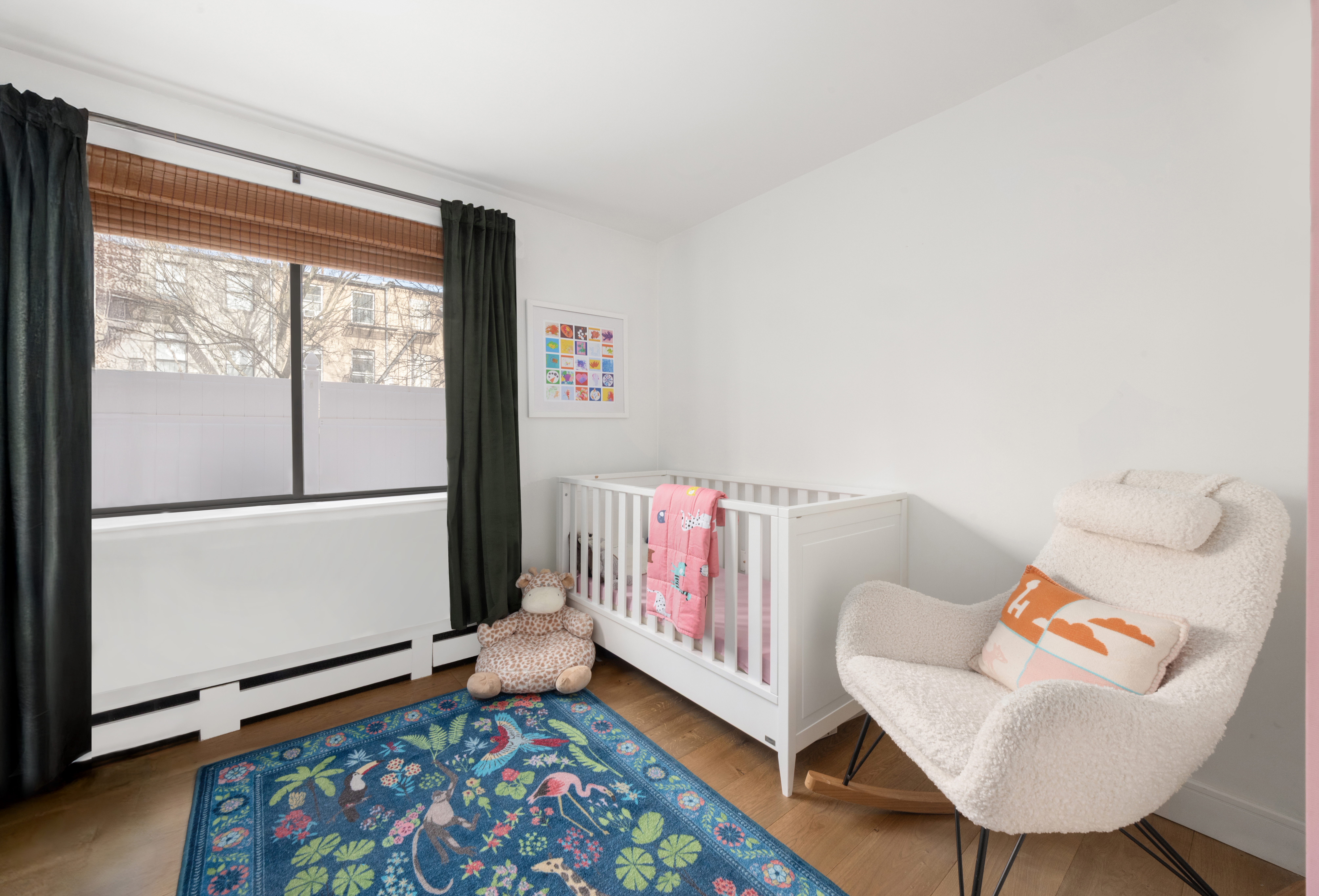 333 East 119th Street, Unit 1H Manhattan, NY 10035 - Photo 14 of 17 a living room with furniture and a window