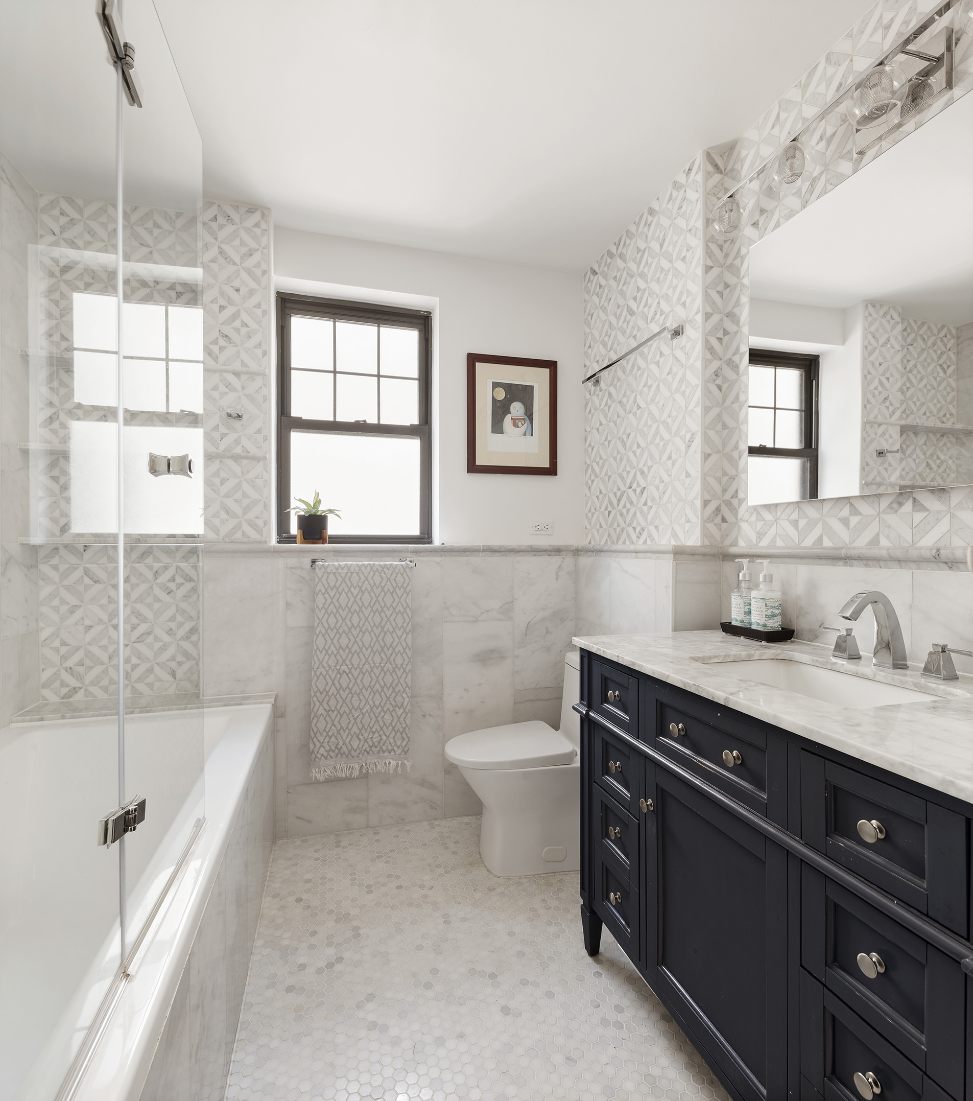 370 Central Park West, Unit PH601 Manhattan, NY 10025 - Photo 13 of 19 a bathroom with a granite countertop sink a toilet a mirror and shower