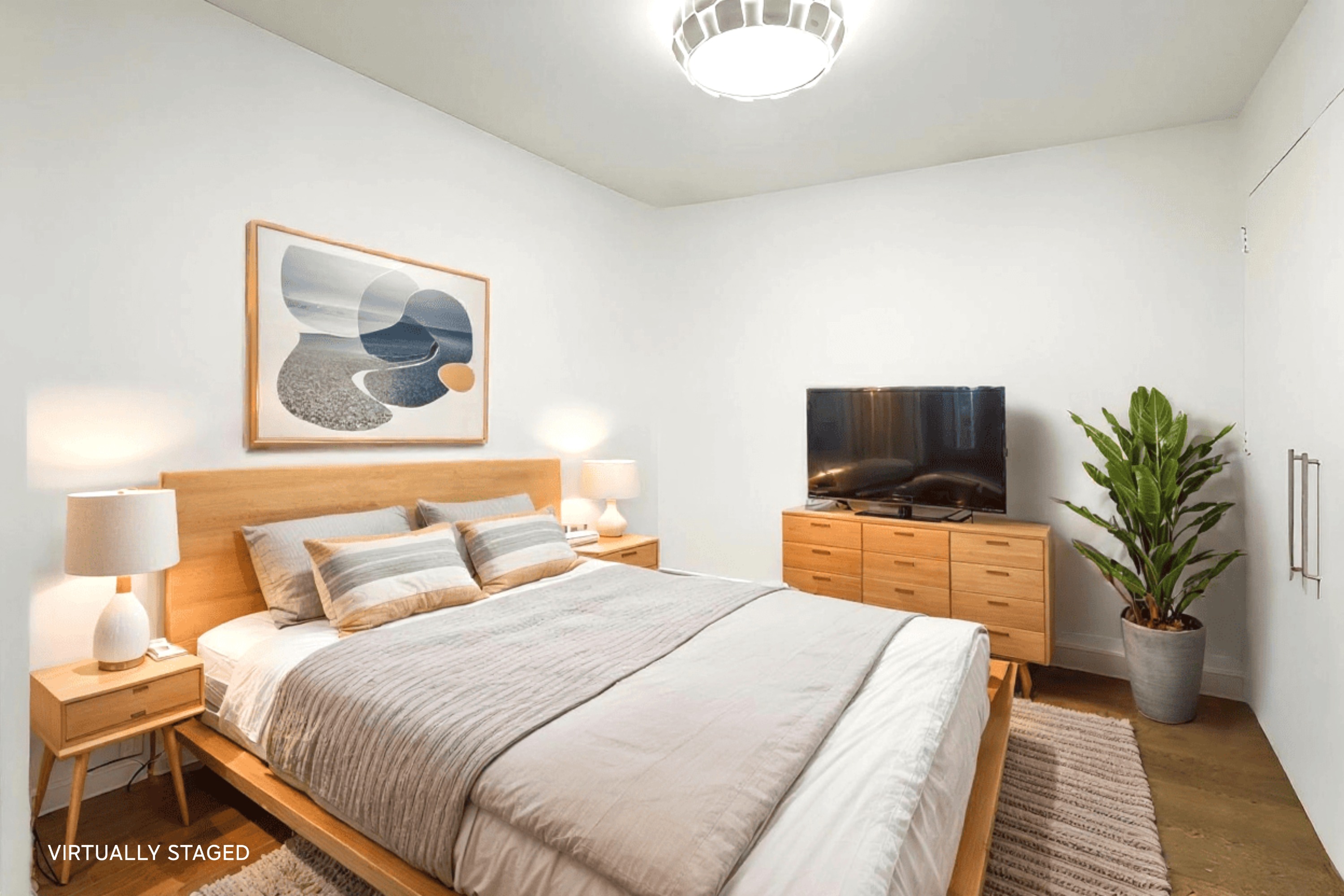 257 West 117th Street, Unit 2G Manhattan, NY 10026 - Photo 7 of 11 a bedroom with a bed and a television