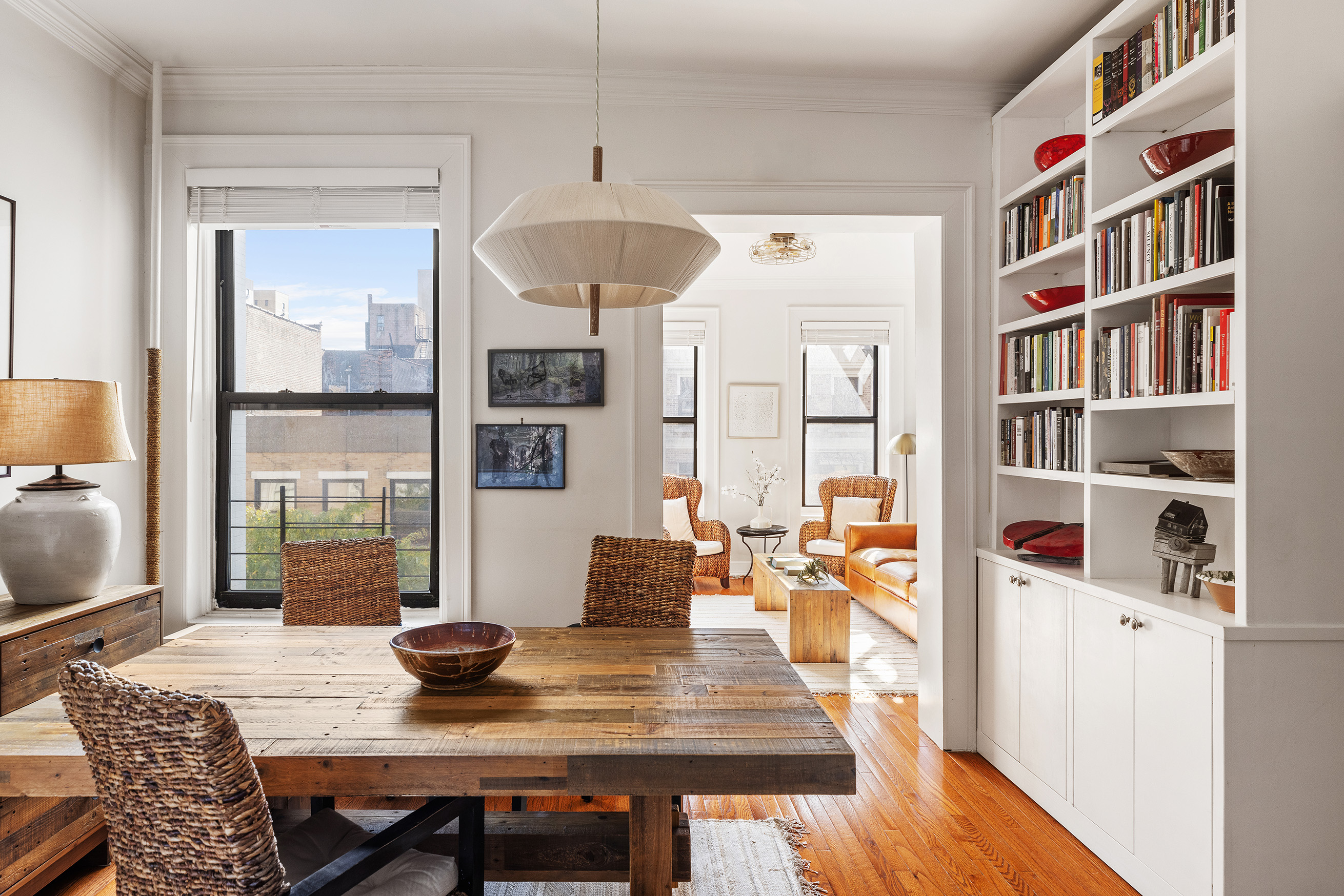 235 West 108th Street, Unit 54 Manhattan, NY 10025 - Photo 1 of 14 a view of a dining room with furniture window and wooden floor