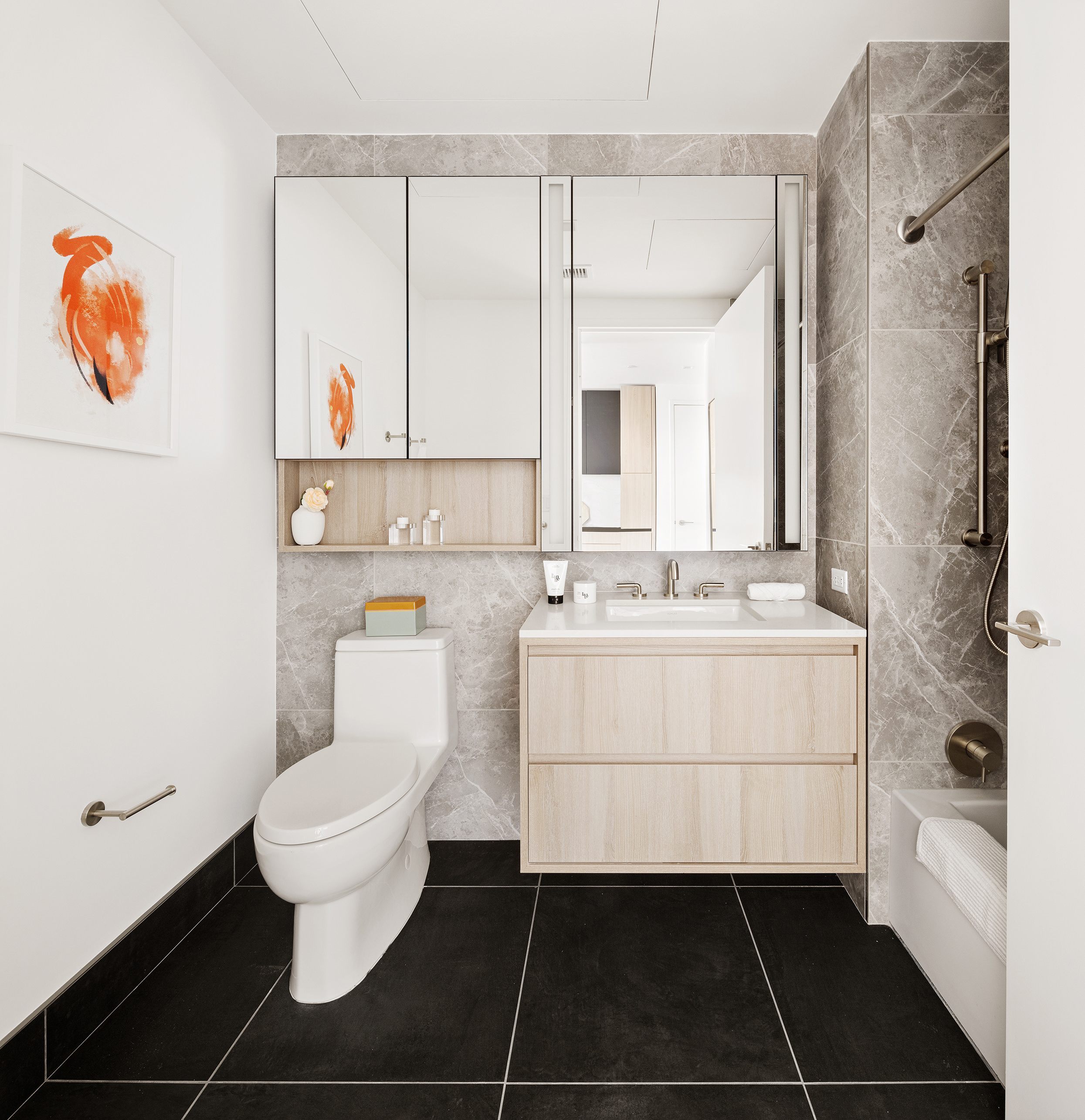 312 West 43rd Street, Unit 31H Manhattan, NY 10036 - Photo 5 of 11 a bathroom with a sink toilet and shower