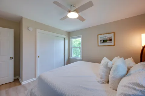 a view of a room with wooden floor