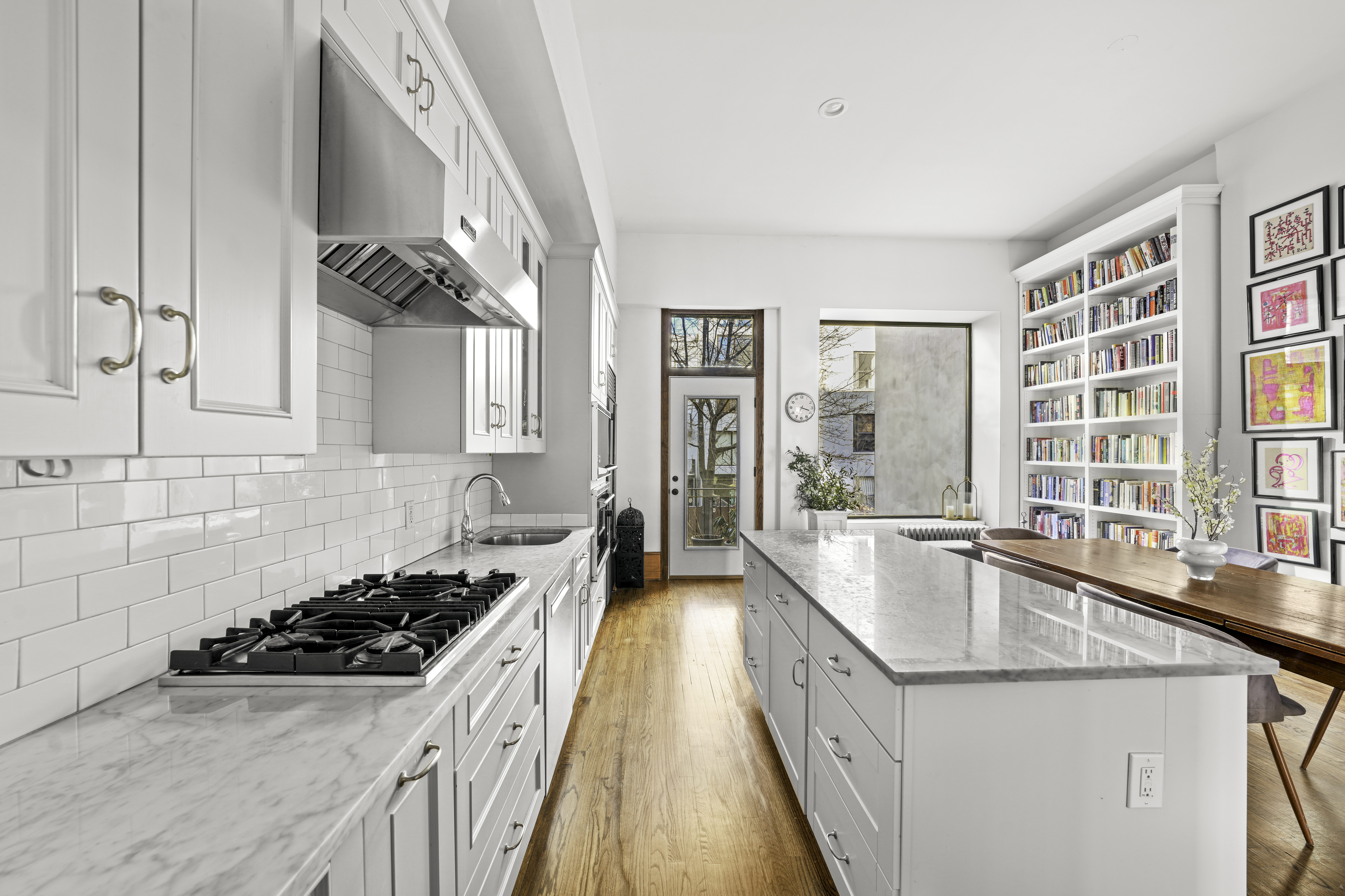 127 West 122nd Street Manhattan, NY 10027 - Photo 9 of 17 a kitchen with a stove a sink and a refrigerator