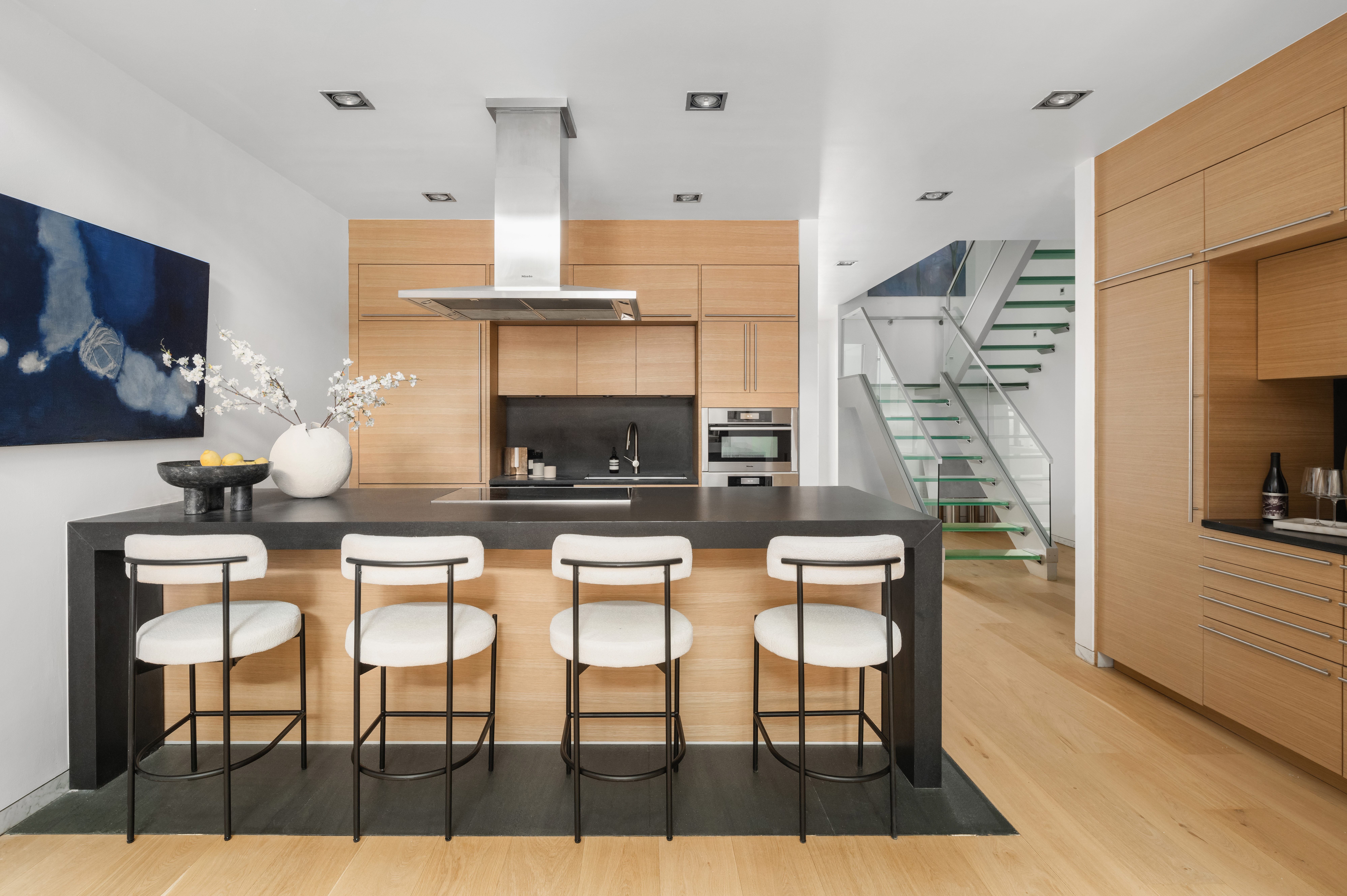 74 Warren Street, Unit 5W Manhattan, NY 10007 - Photo 3 of 15 a living room with furniture a flat screen tv and a fireplace