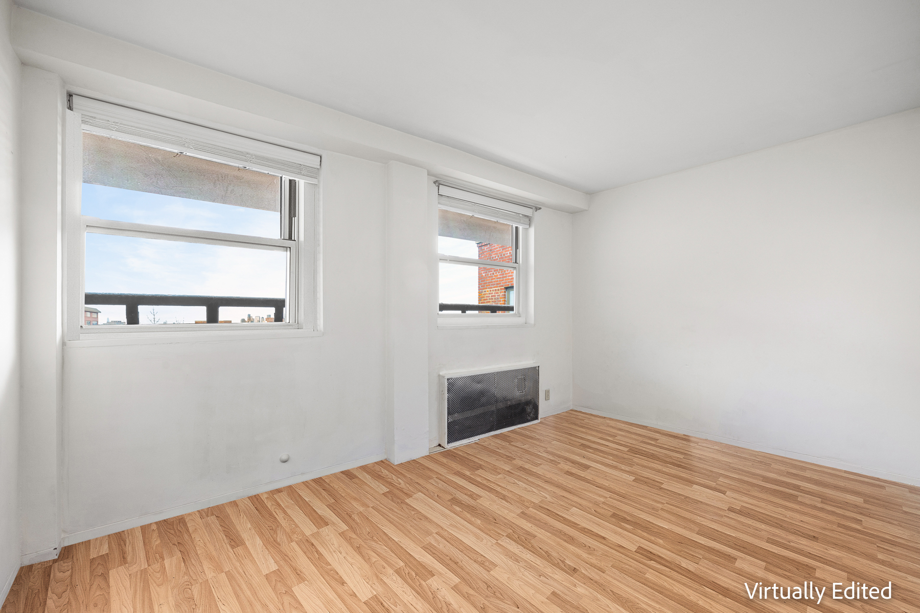 35-50 85th Street, Unit 9J Queens, NY 11372 - Photo 6 of 11 a bedroom with a bed and a window