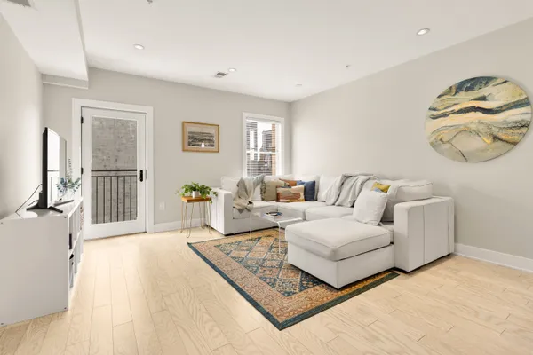 a living room with furniture and a window
