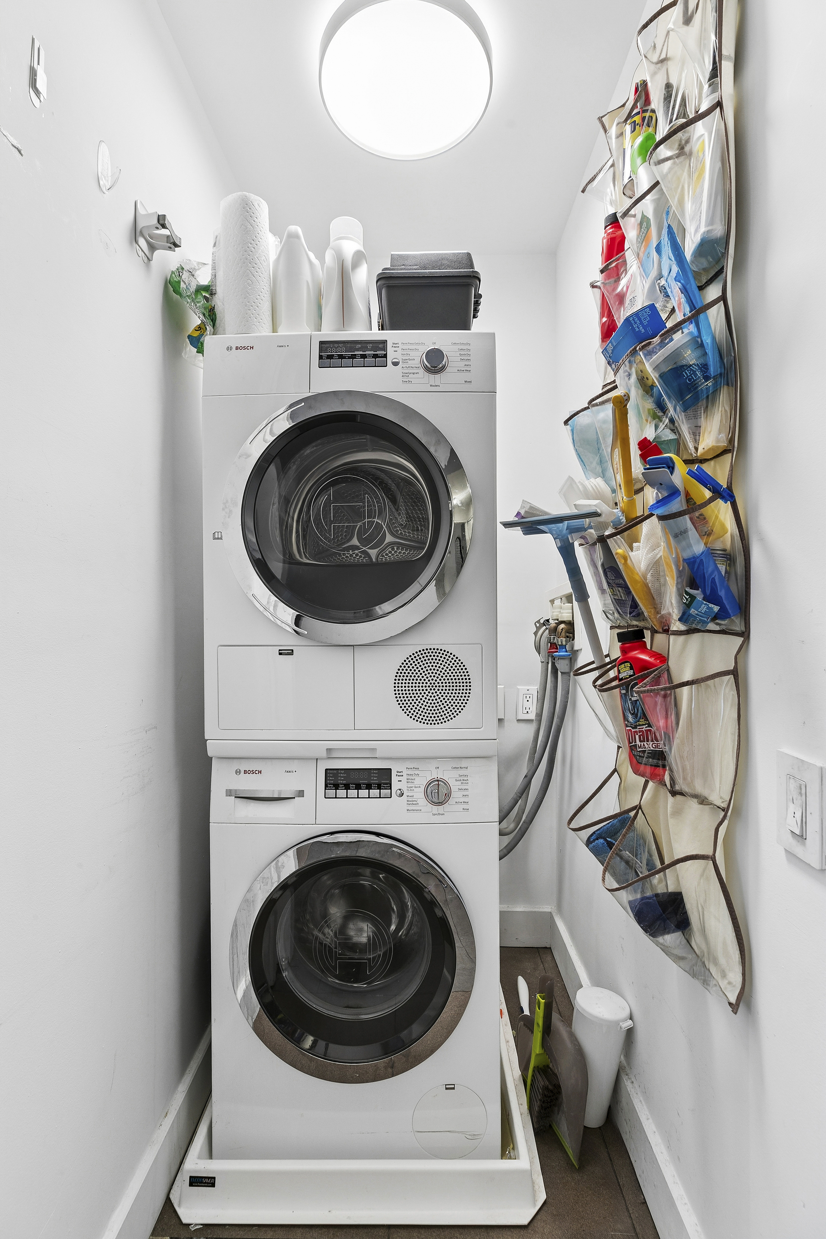 1065 Park Avenue, Unit 4BC Manhattan, NY 10128 - Photo 13 of 16 a utility room with dryer and washer