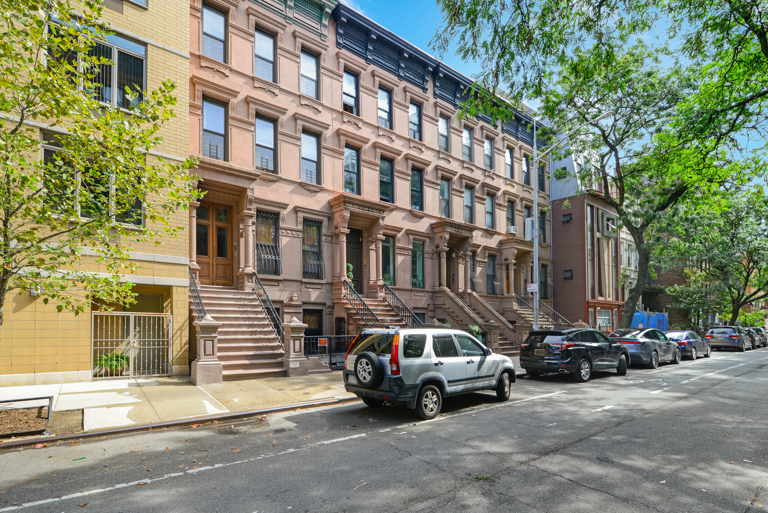 3 East 128th Street, Unit GARDEN Manhattan, NY 10035 - Photo 9 of 10 a car parked in front of a building