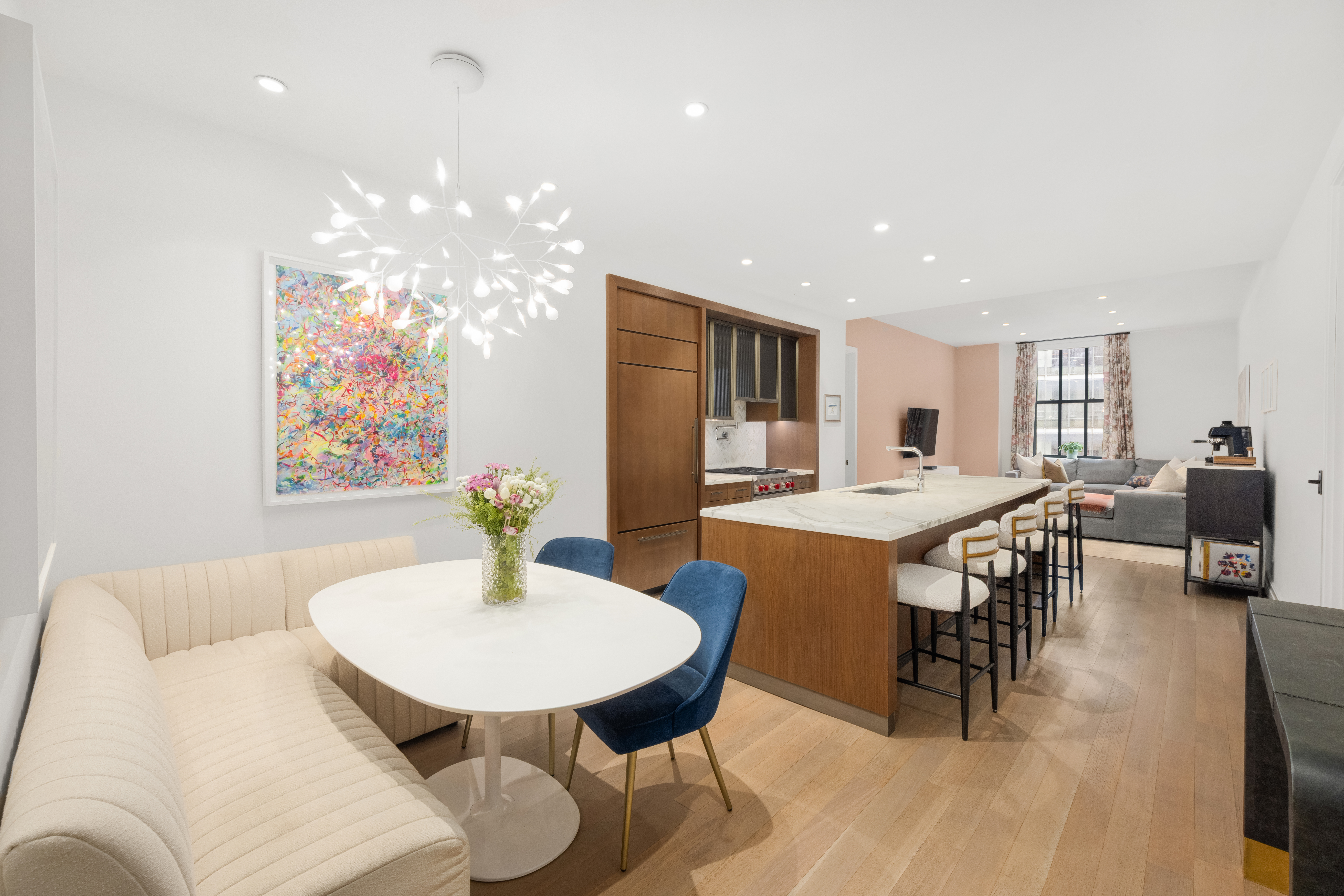a view of a dining room with furniture and wooden floor