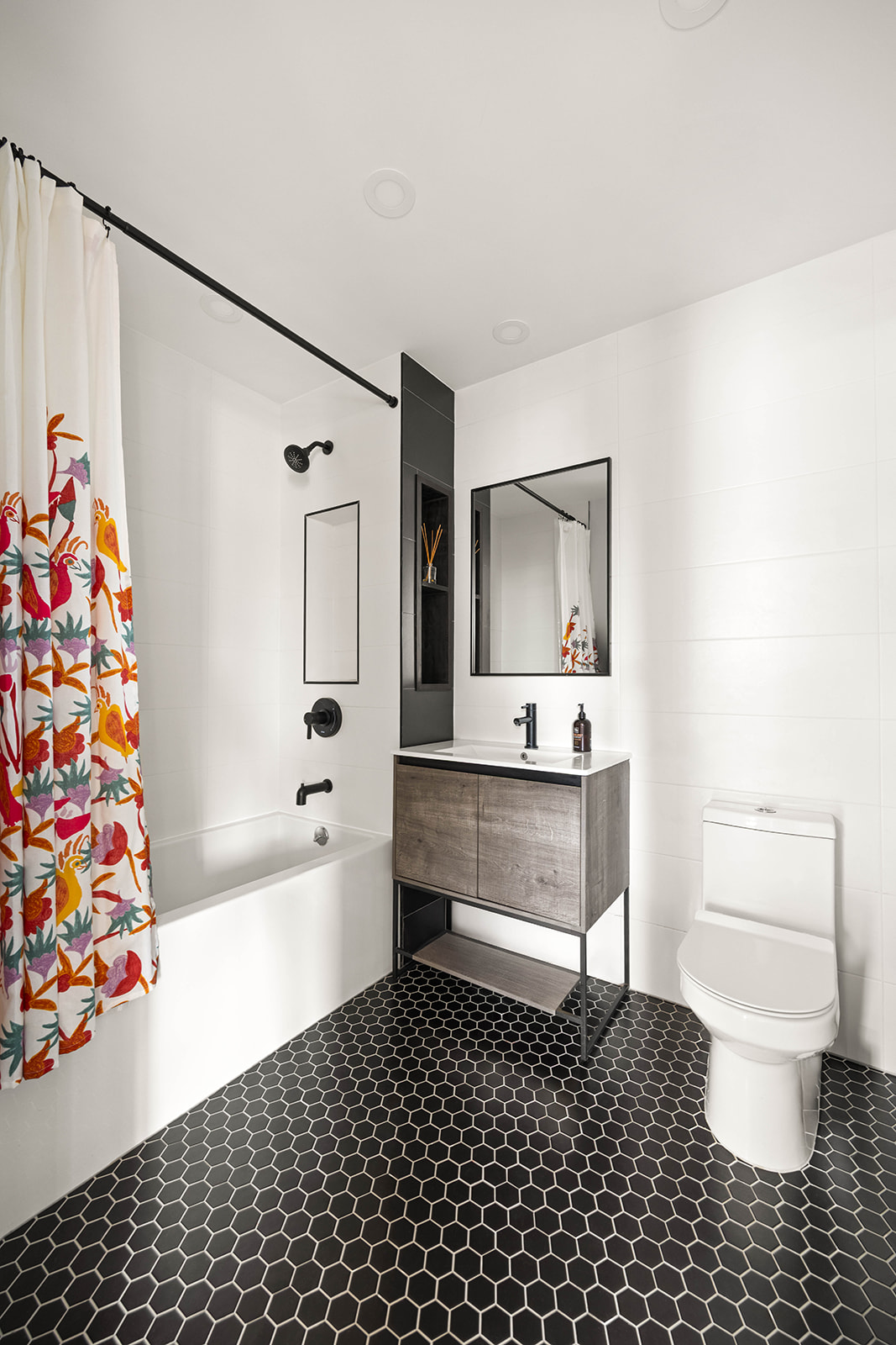 511 Evergreen Avenue, Unit 3D Brooklyn, NY 11221 - Photo 6 of 8 a bathroom with a sink a toilet and shower curtain