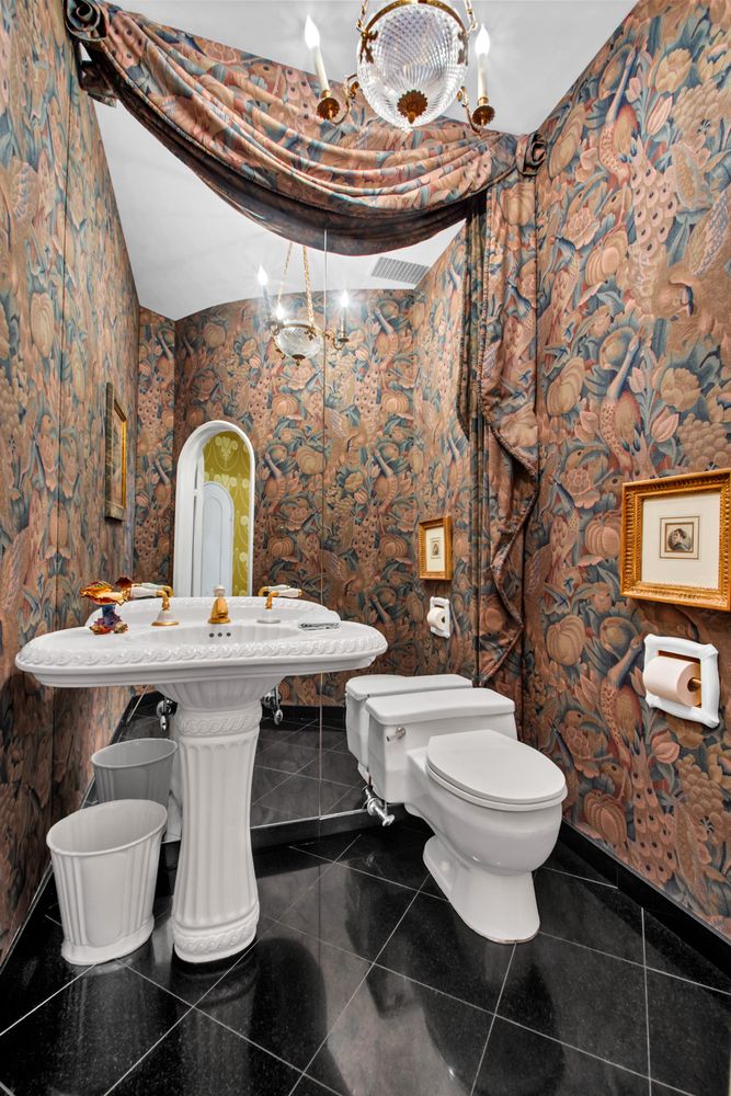 a view of an outdoor dining space with a table and chairs