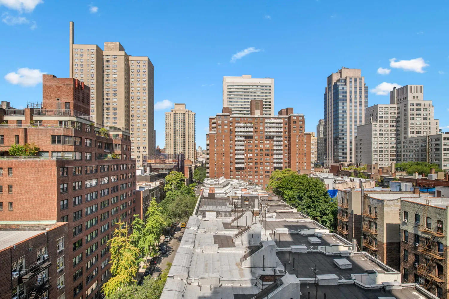 a view of a city with tall buildings