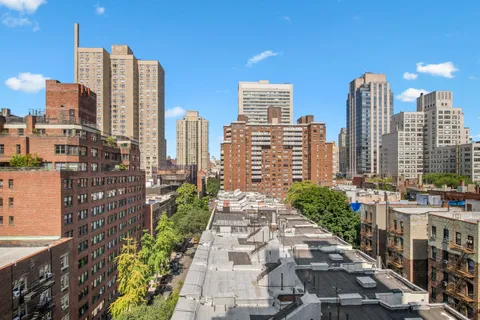 a view of a city with tall buildings