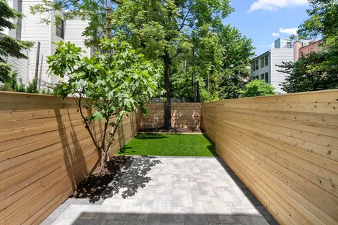 a view of a pathway with a garden
