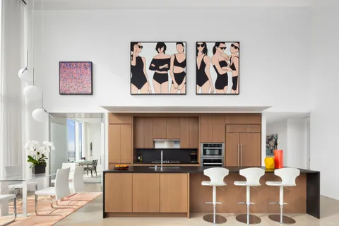 a kitchen with a table and chairs in it