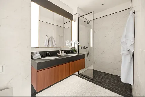 a work room with furniture and a book shelf