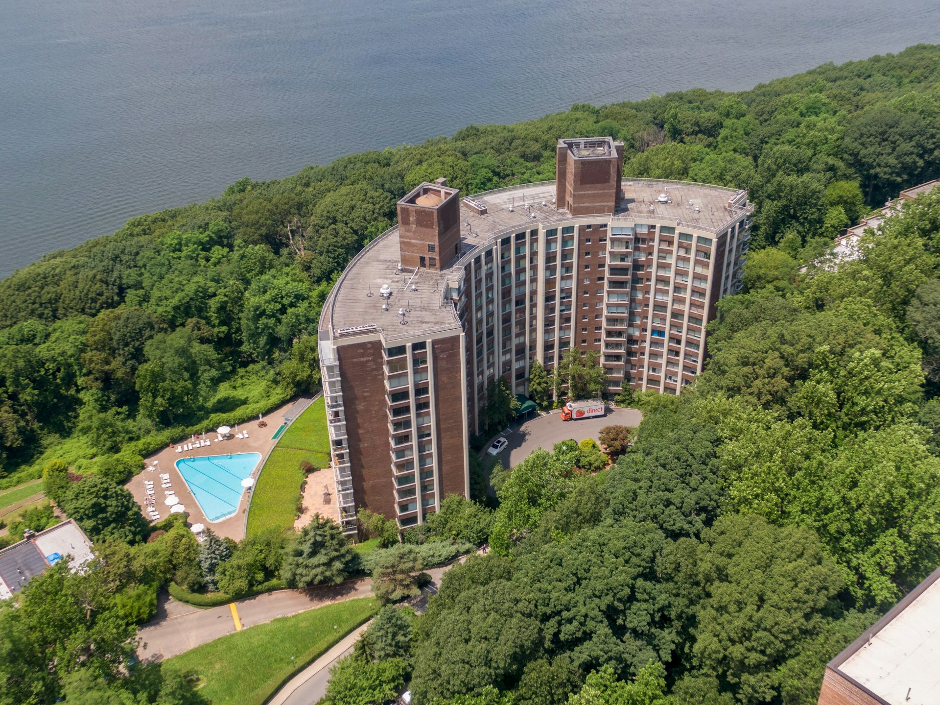 4455 Douglas Avenue, Unit 3F Bronx, NY 10471 - Photo 25 of 27 an aerial view of a house with a yard and garden