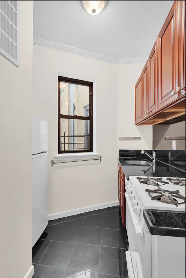 370 Columbus Avenue, Unit 2C Manhattan, NY 10024 - Photo 4 of 10 a kitchen that has a stove and a sink