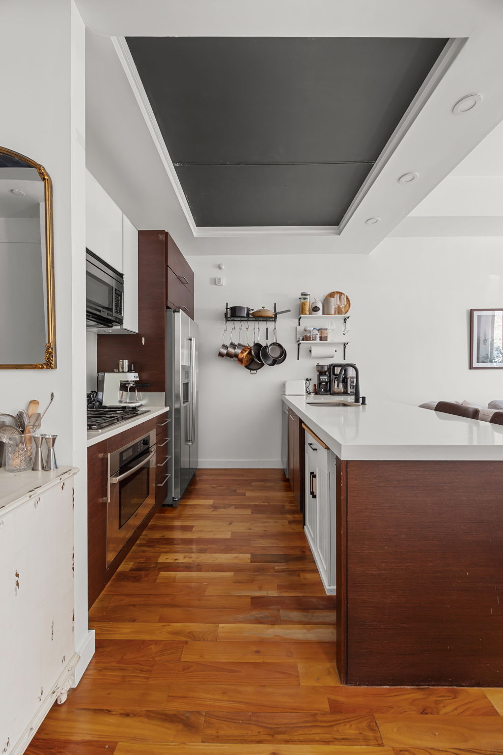 161 North 4th Street, Unit 1C Brooklyn, NY 11211 - Photo 2 of 10 a kitchen with stainless steel appliances a stove a sink and a refrigerator