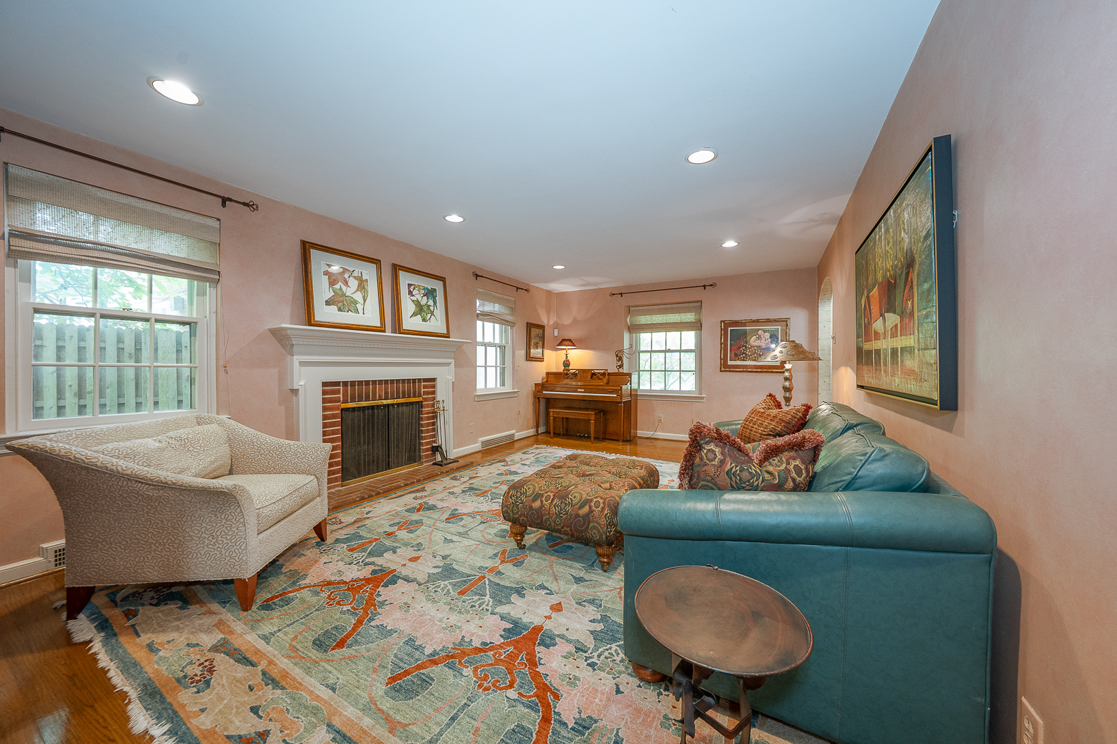 519 Mercer Road Merion Station, PA 19066 - Photo 24 of 58 a living room with furniture a fireplace and a table