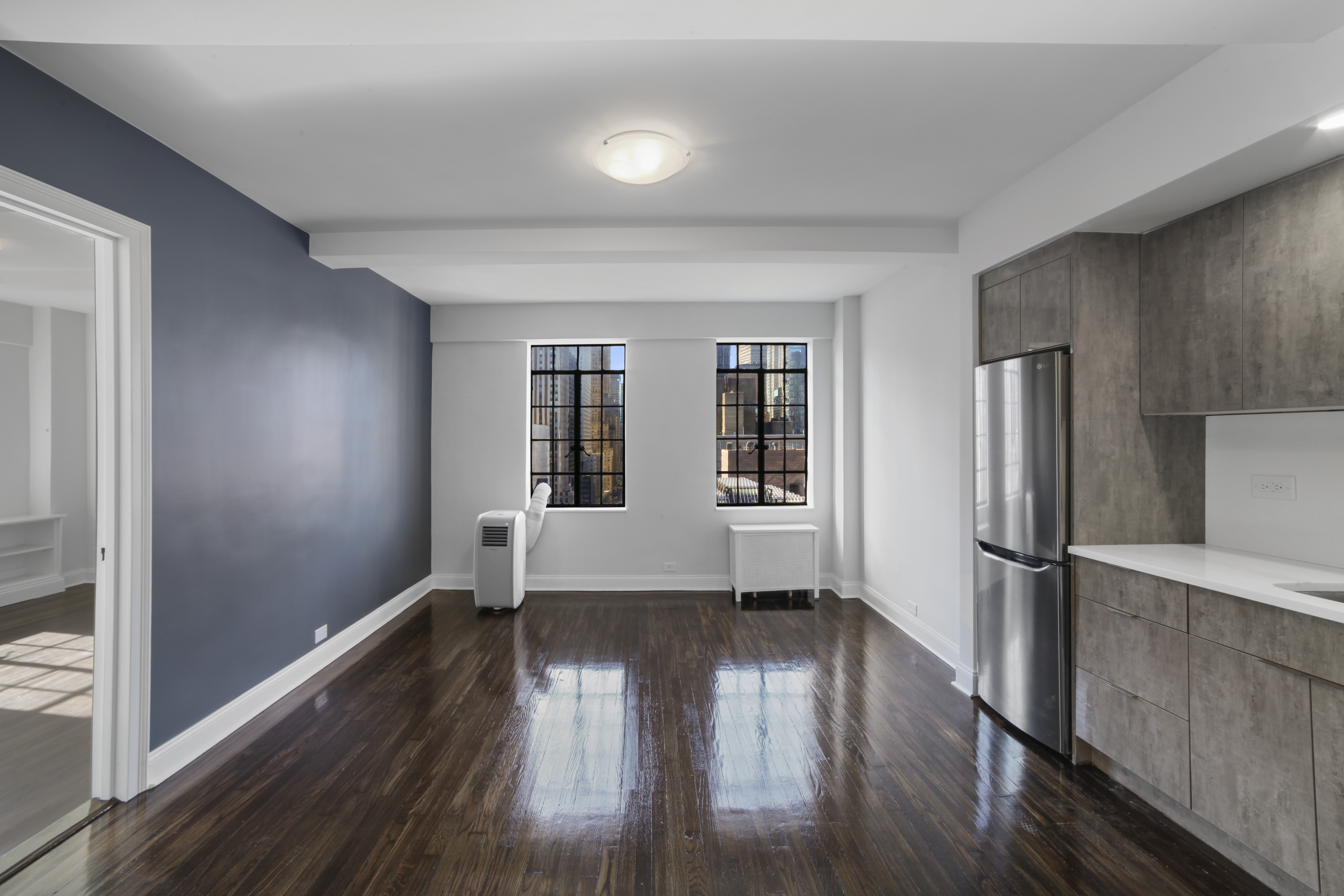 a view of entryway with wooden floor and a window