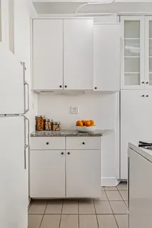 a kitchen with cabinets and appliances
