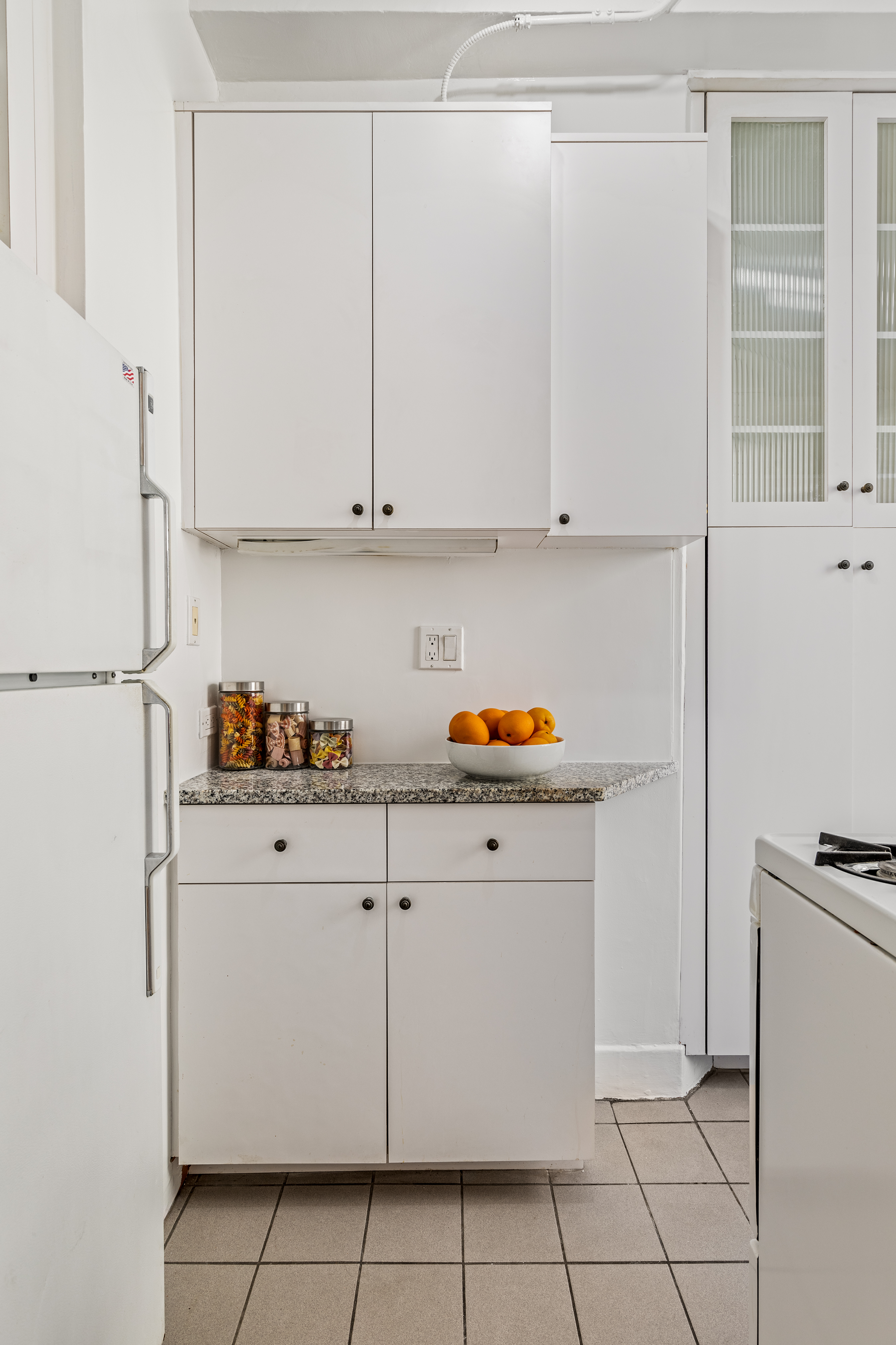 599 West End Avenue, Unit 5A Manhattan, NY 10024 - Photo 4 of 11 a kitchen with cabinets and appliances