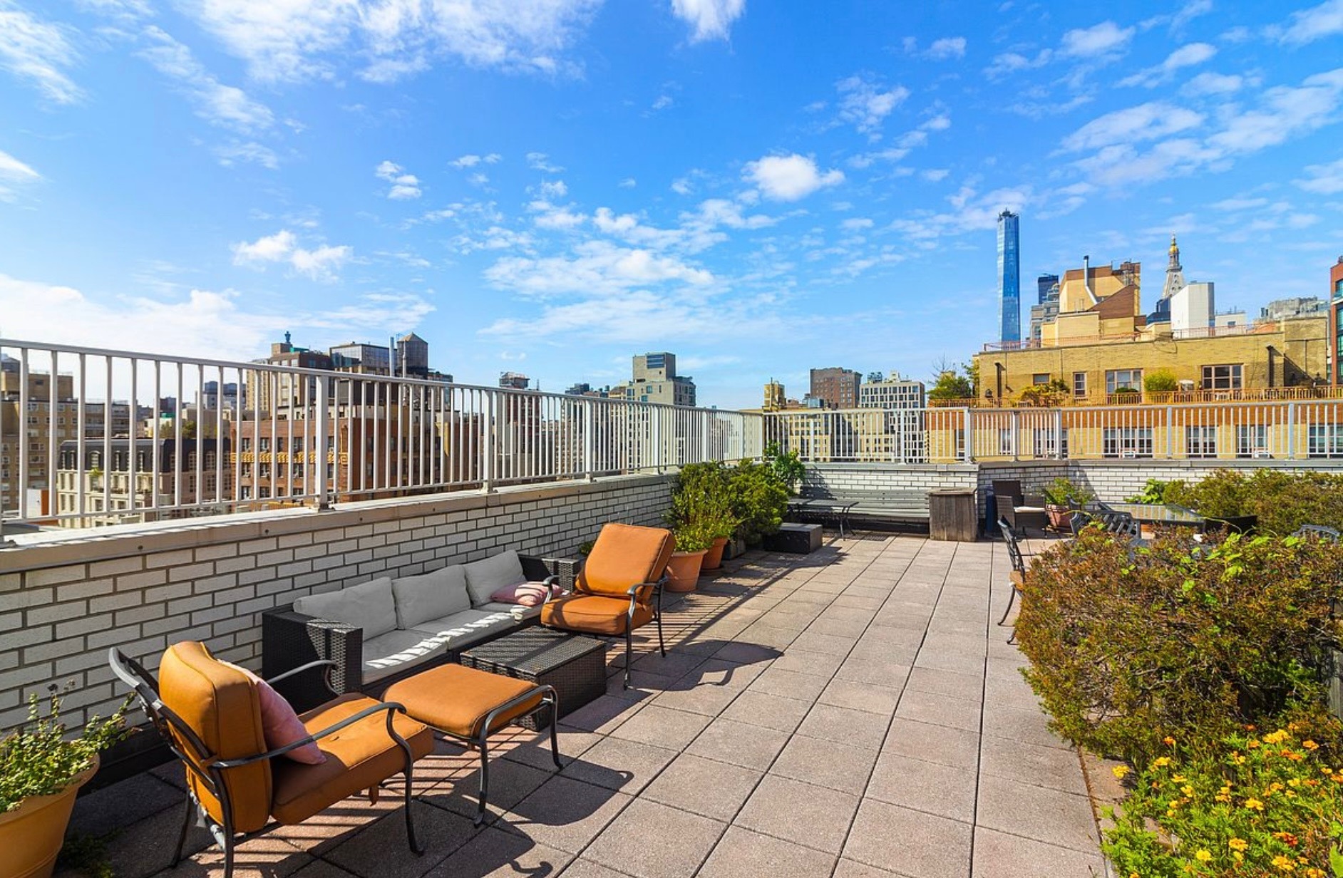 301 East 22nd Street, Unit 2H Manhattan, NY 10010 - Photo 15 of 16 a view of a patio with couches table and chairs and potted plants