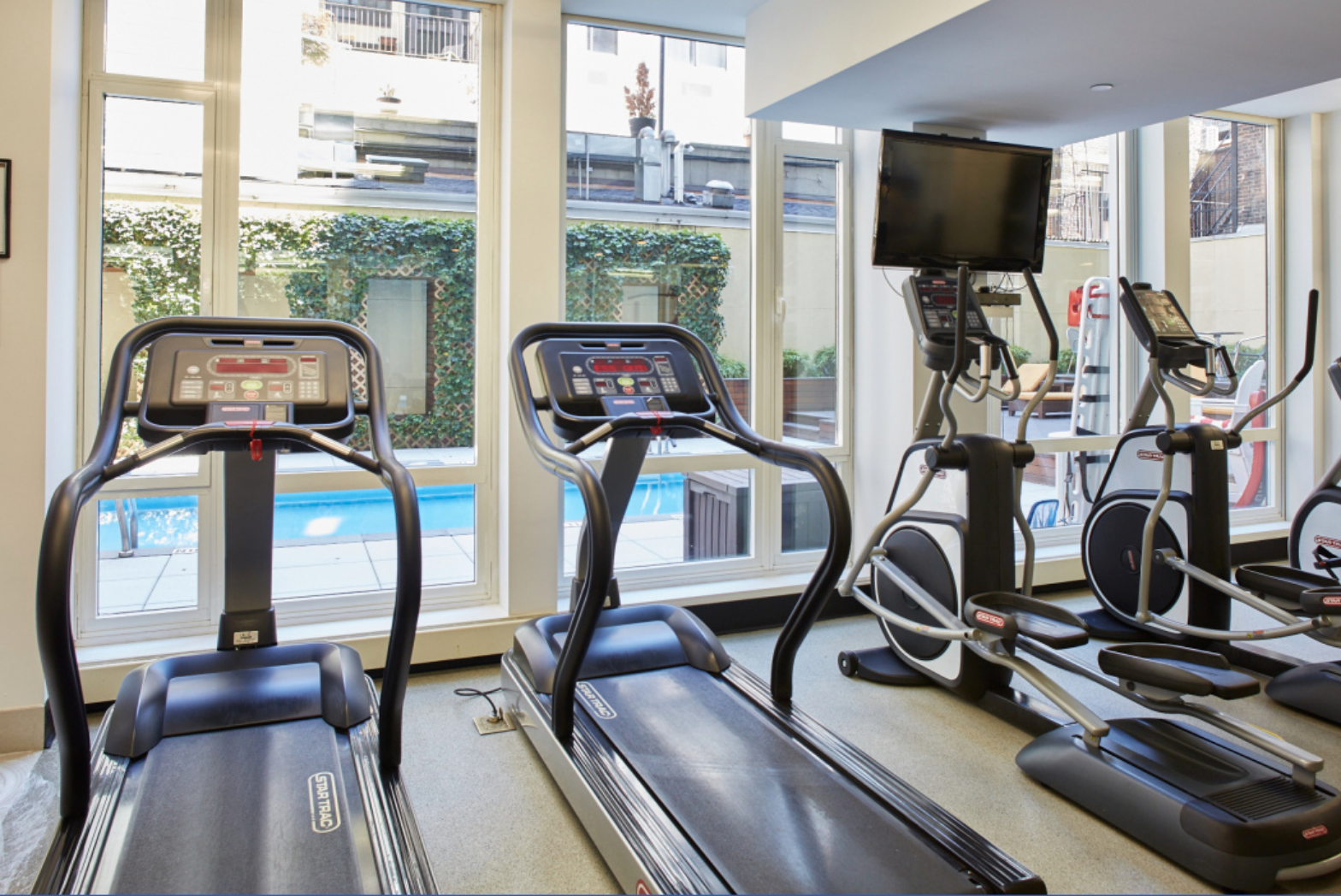 133 West 22nd Street, Unit 8G Manhattan, NY 10011 - Photo 12 of 16 a view of a room with gym equipment