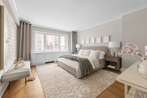 a spacious bedroom with a bed and a window