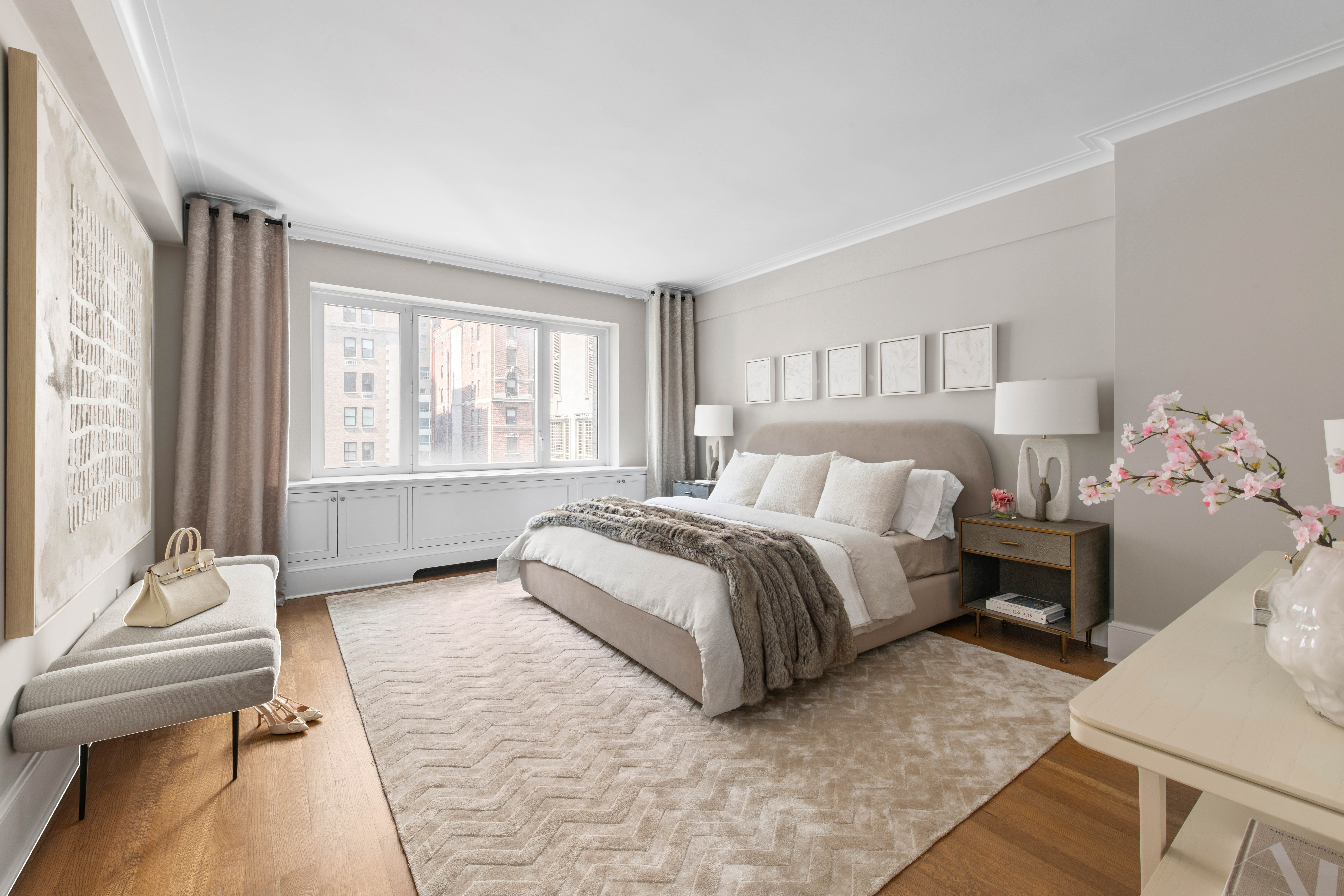 530 Park Avenue, Unit 12A Manhattan, NY 10065 - Photo 12 of 27 a spacious bedroom with a bed and a window