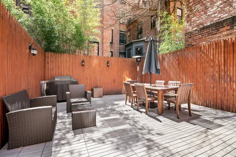 a view of a dinning tables and chairs in a patio