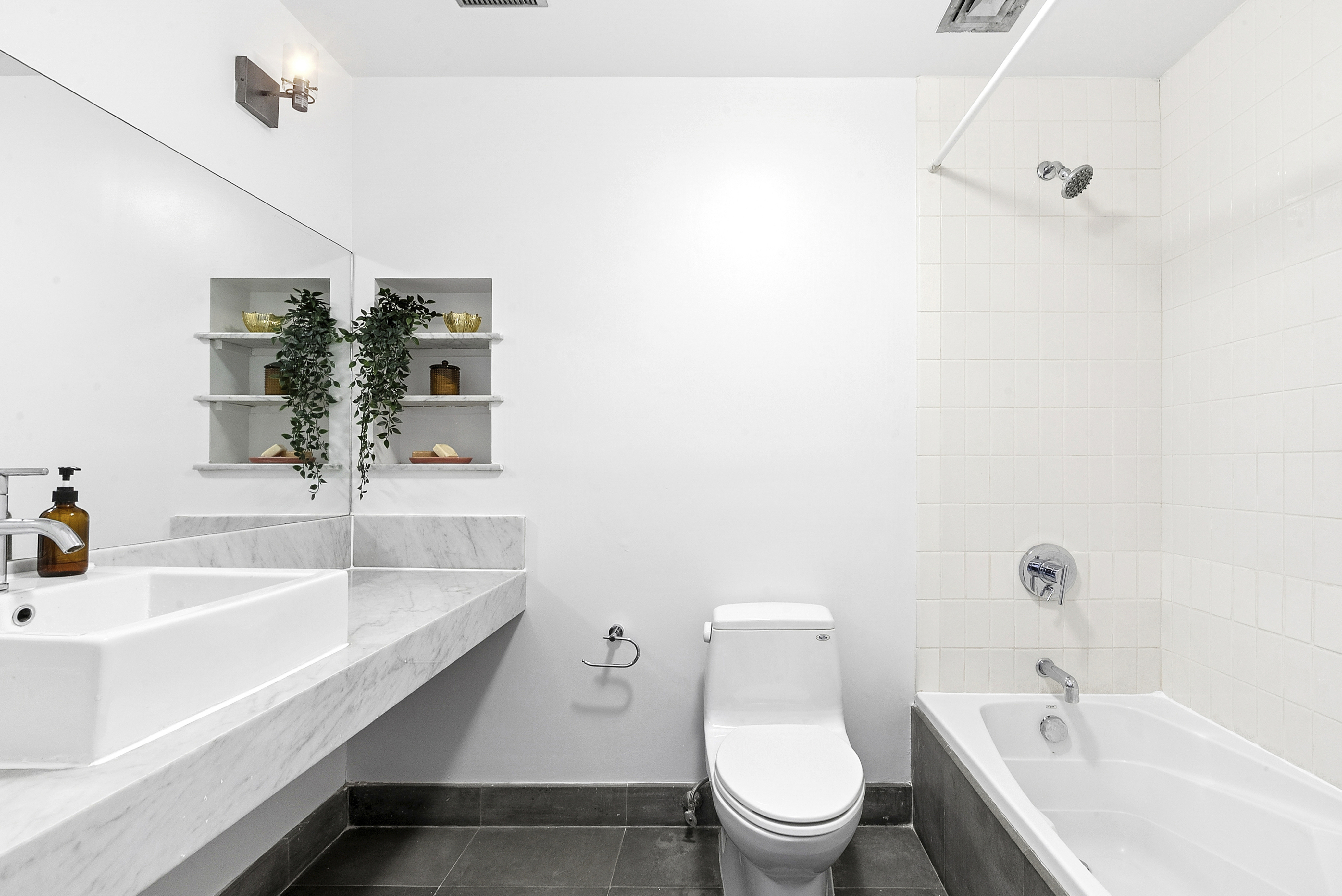 201 Spencer Street, Unit 3A Brooklyn, NY 11205 - Photo 9 of 11 a bathroom with a sink a toilet and shower