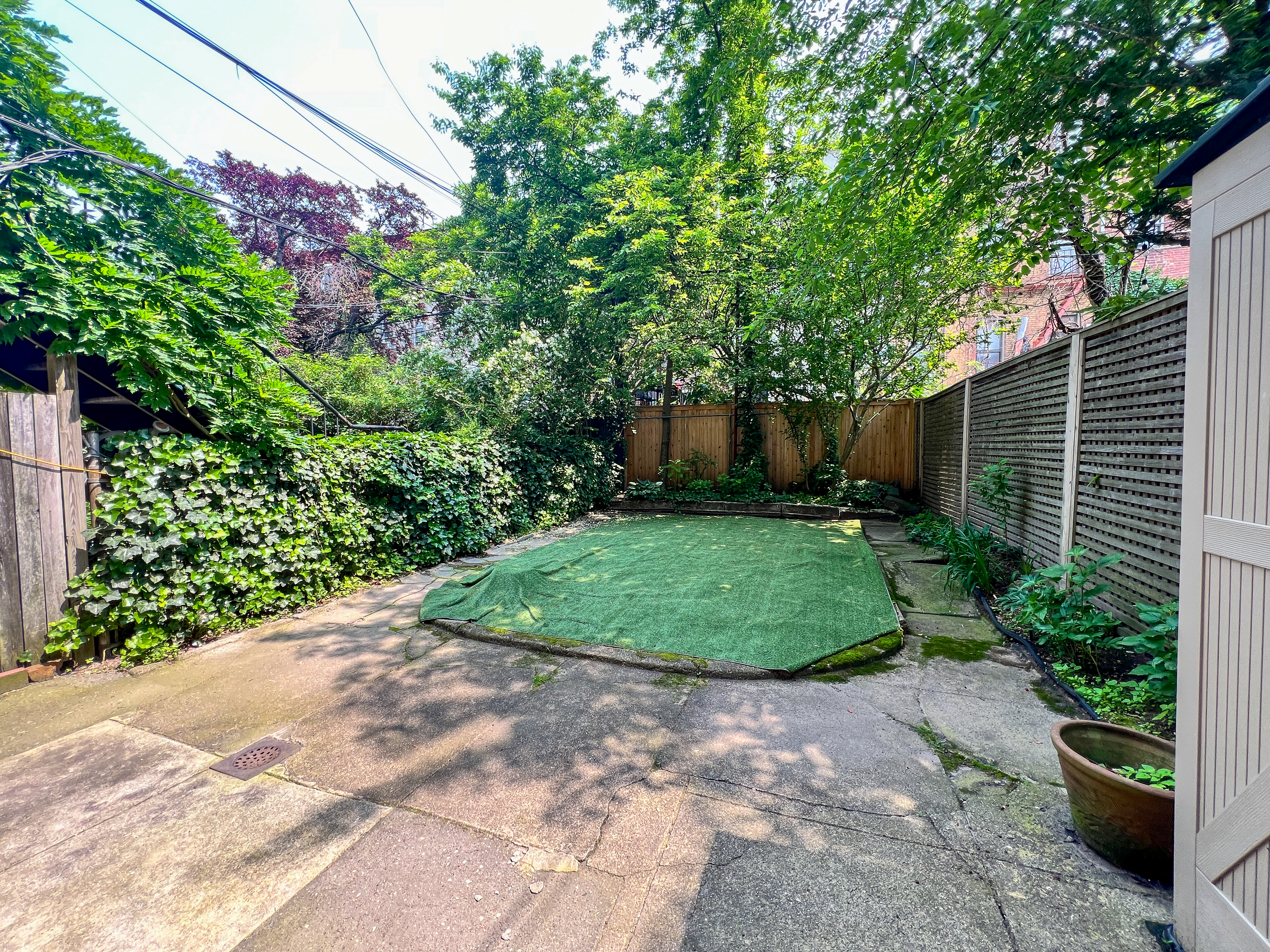 651 10th Street, Unit 1 Brooklyn, NY 11215 - Photo 11 of 12 a view of a garden with potted plants