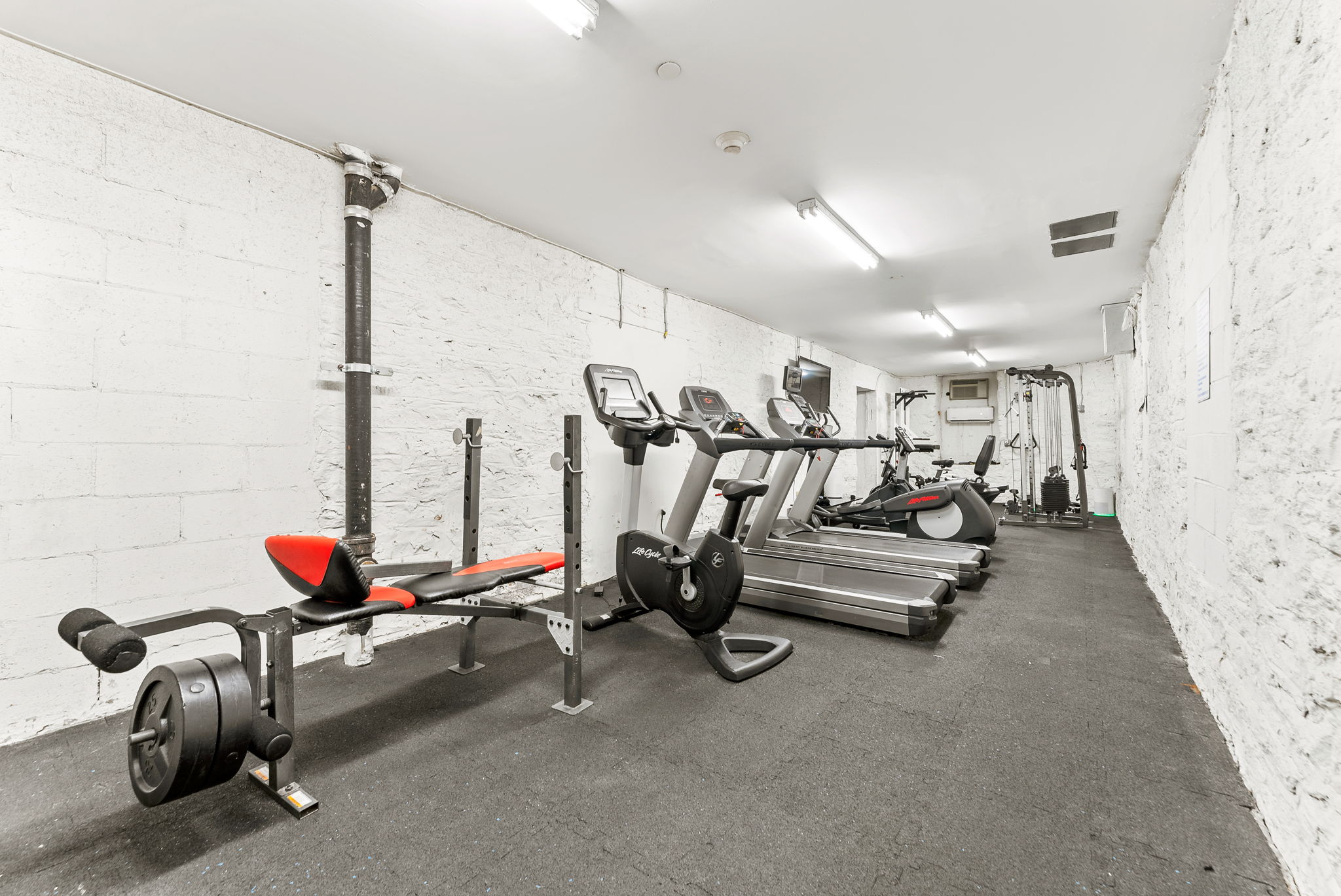 305 West 150th Street, Unit 511 Manhattan, NY 10039 - Photo 10 of 17 a room with gym equipment