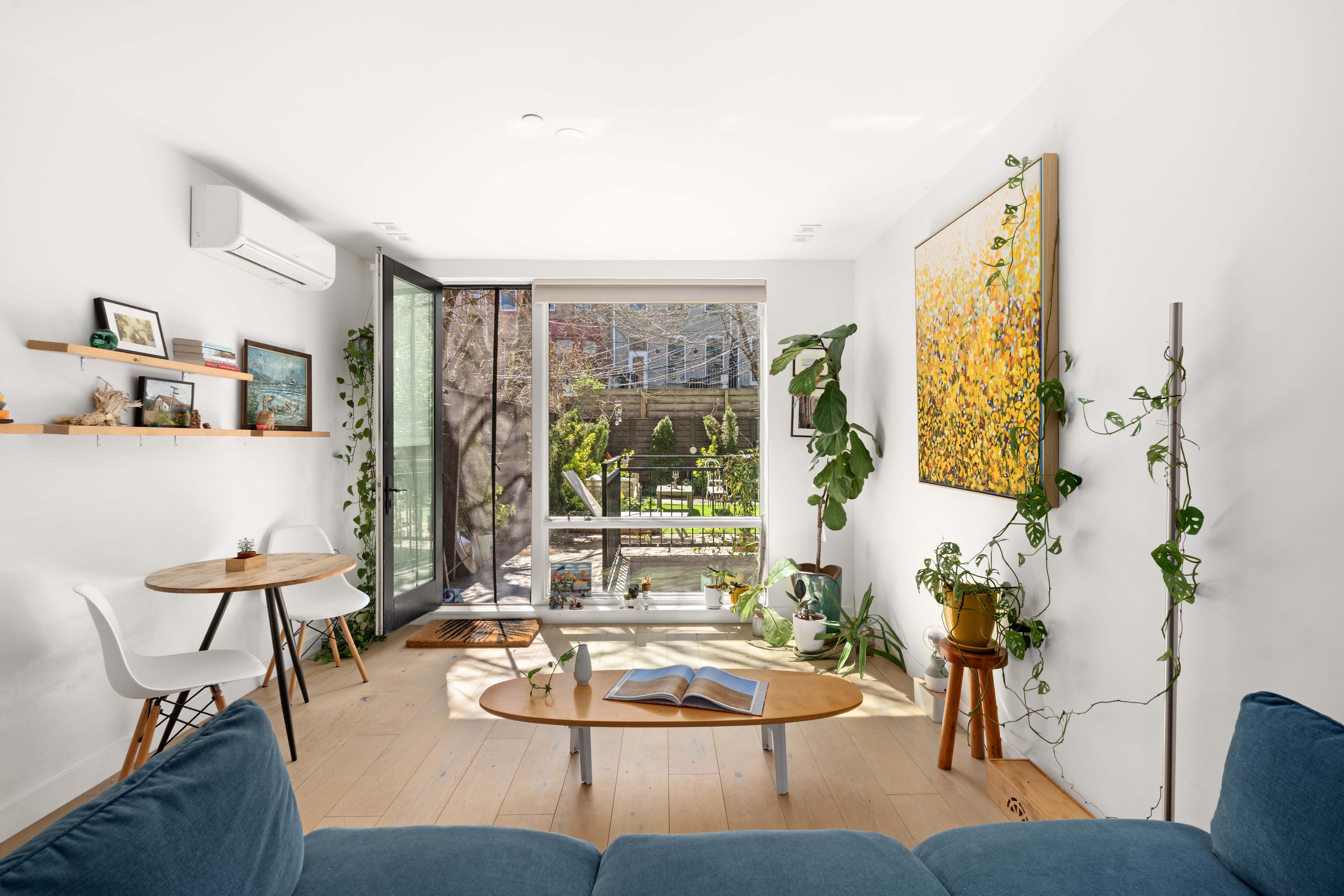 676 Halsey Street, Unit 1B Brooklyn, NY 11233 - Photo 2 of 9 a living room with furniture and a large window
