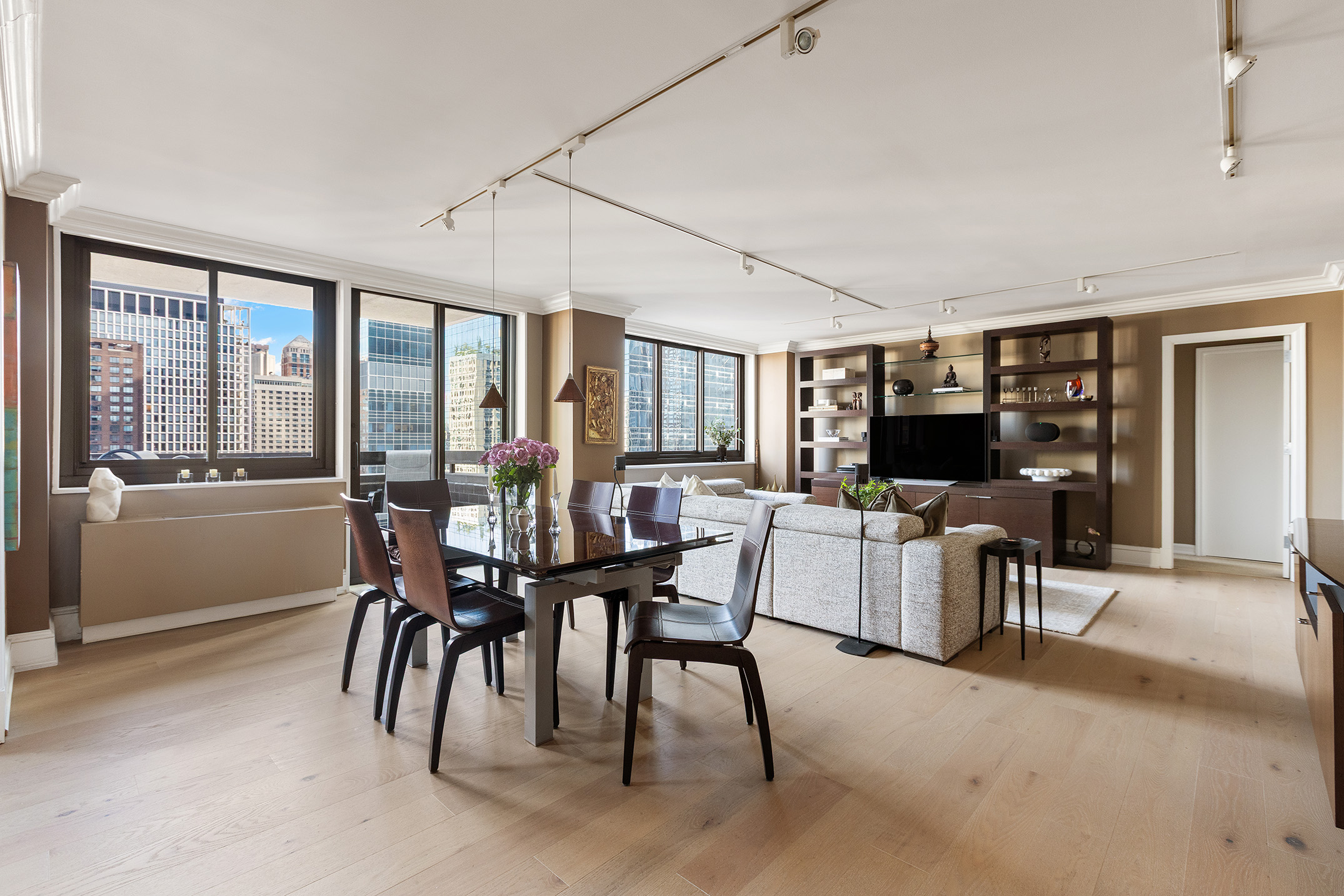 347 West 57th Street, Unit 25AB Manhattan, NY 10019 - Photo 3 of 21 a view of a dining room with furniture window and outside view