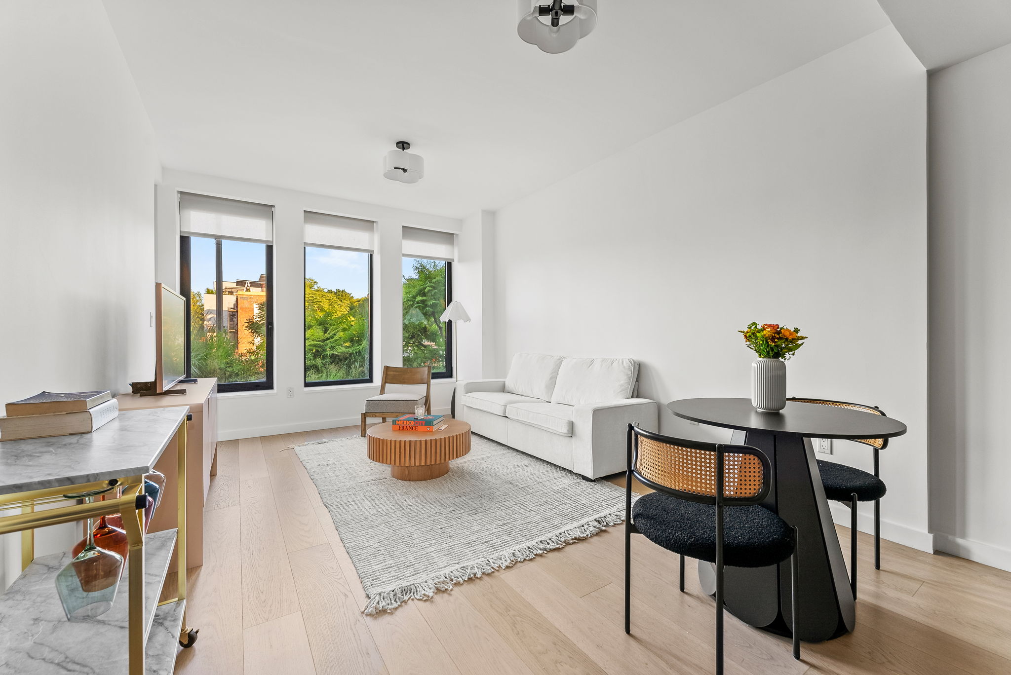 58 St Marks Place, Unit 206 Brooklyn, NY 11217 - Photo 3 of 27 a dining room with furniture and window