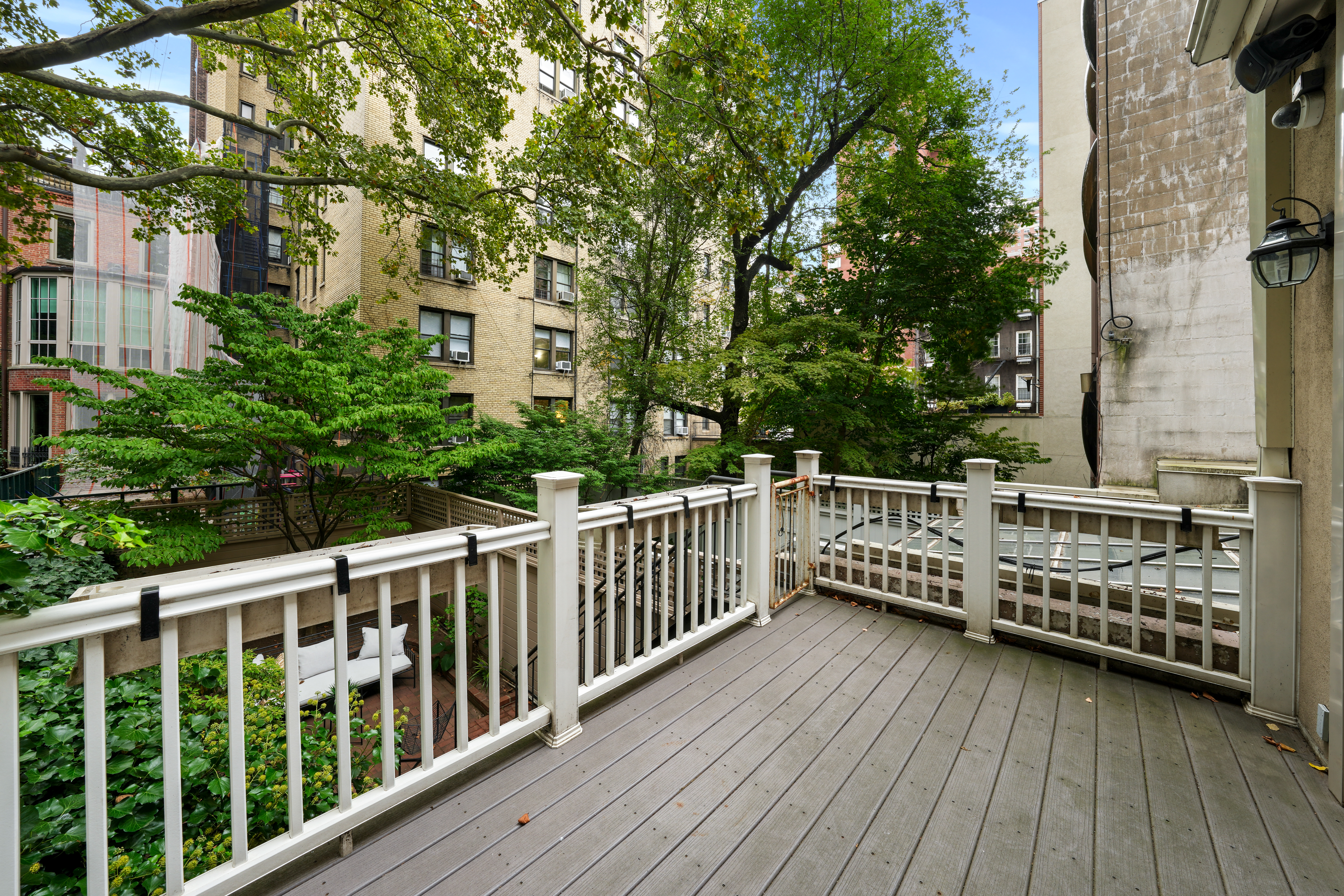 247 East 71st Street Manhattan, NY 10021 - Photo 13 of 31 a view of balcony with wooden floor and fence